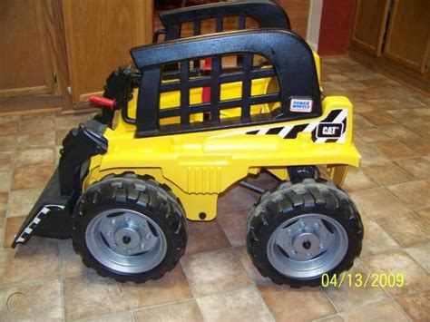 caterpillar power wheels skid steer|cat skid steer charger cost.